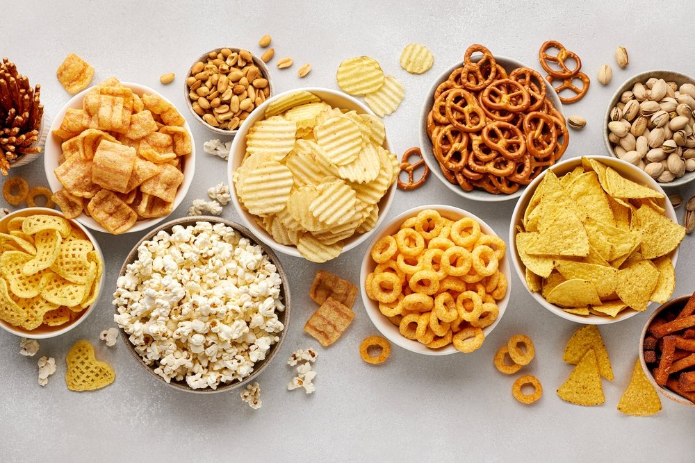 Set,Of,Many,Bowl,With,Different,Salty,Snacks,On,Light High calorie snack
