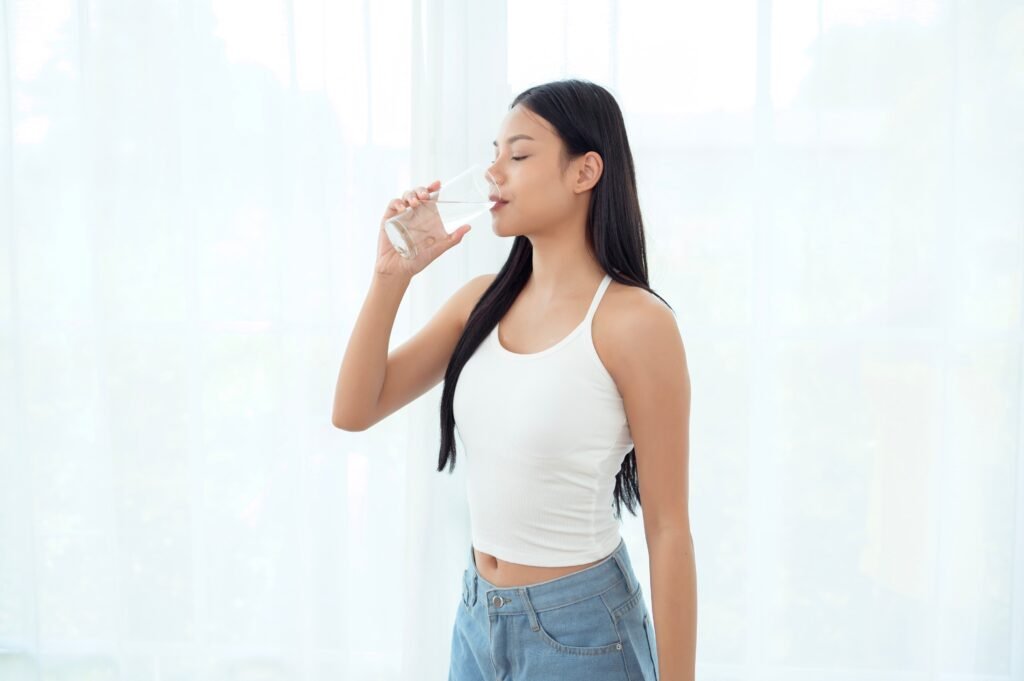 Young,Asian,Woman,Drinking,Water,Bedroom,At,Home Check your hydration status